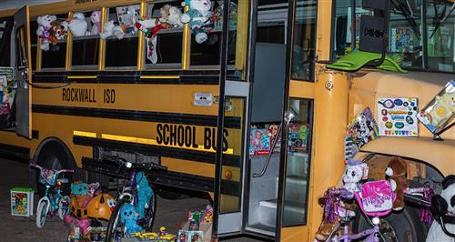 Rockwall ISD Transportation Department and Rochell ES Stuff the Bus for Helping Hands 